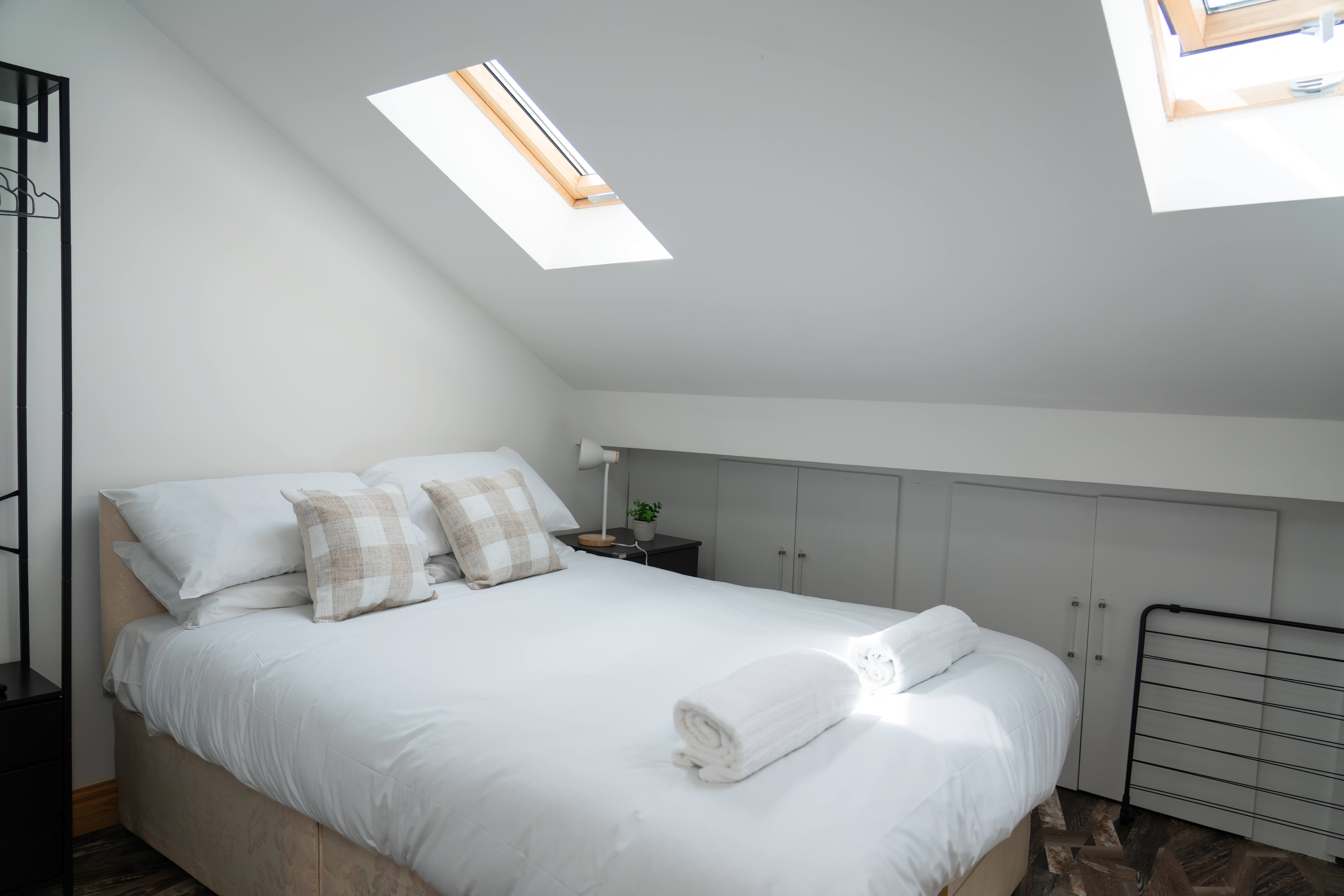 Bright loft bedroom with skylight